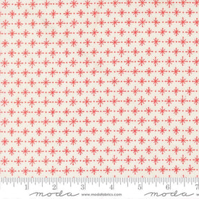 a repeating pattern of red dots and lines on a cream-colored background.
