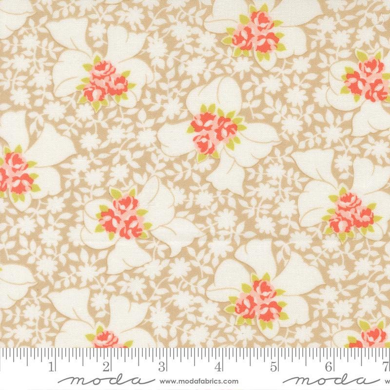The image is a fabric with a floral pattern, featuring white flowers with red centers. The fabric appears to be a light brown color, and there is a ruler for scale at the bottom of the image.