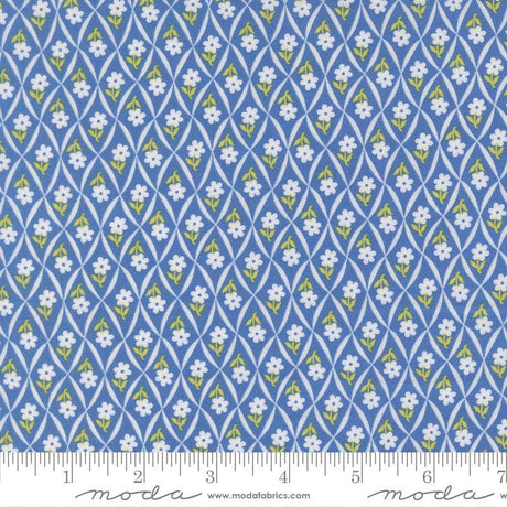 a repeating pattern of blue and yellow flowers on a fabric surface.