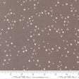 a brown fabric with small white flowers scattered across it.