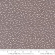 The image is a fabric with a repeating pattern of small white dots or circles on a brown background.