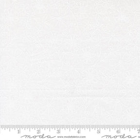 The image is a white fabric with a repeating pattern of flowers and leaves.