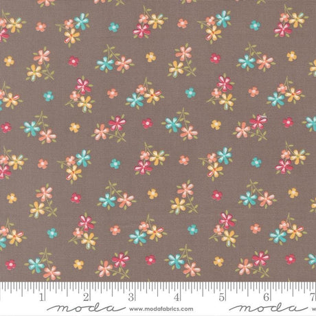 a repeating pattern of small, colorful flowers on a brown background.
