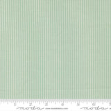 The image is a close-up of a fabric with a striped pattern in a light green color.
