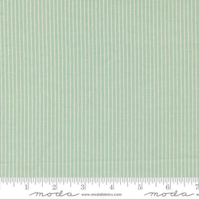 The image is a close-up of a fabric with a striped pattern in a light green color.