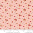 The image is a fabric with a repeating floral pattern in shades of pink and white. The pattern consists of small red flowers and leaves scattered across the fabric, creating a visually appealing and intricate design.