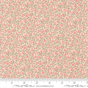 The image is a fabric with a floral pattern, featuring small pink flowers and leaves. The fabric appears to be a light-colored material, possibly beige or cream, with a repeating pattern of pink flowers and green leaves. The image does not contain any text or additional objects, and the focus is on the floral pattern.