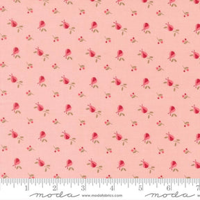 a repeating pattern of pink flowers and leaves on a fabric surface.