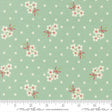 a fabric with a repeating pattern of white flowers with red bows against a light green background with white polka dots.