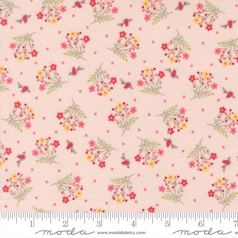 The image is a fabric with a repeating pattern of pink flowers and birds on a light pink background.