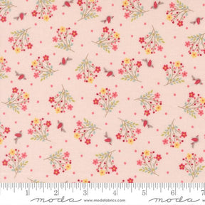 The image is a fabric with a repeating pattern of pink flowers and birds on a light pink background.