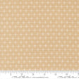 a fabric with a repeating pattern of white snowflakes on a beige background.