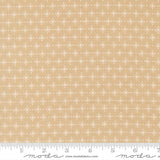 a fabric with a repeating pattern of white snowflakes on a beige background.