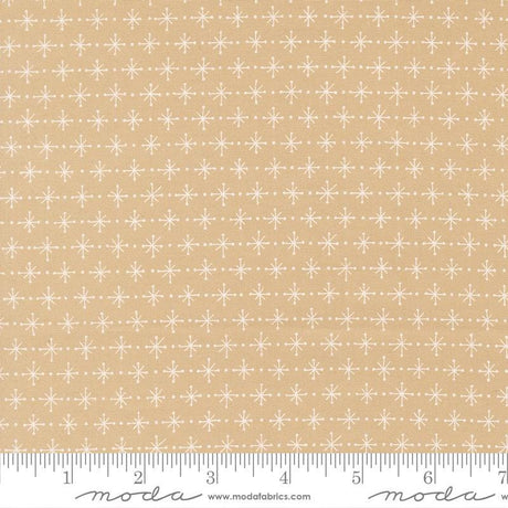 a fabric with a repeating pattern of white snowflakes on a beige background.