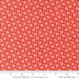 The image is a red fabric with a repeating pattern of white flowers or leaves. The pattern is evenly spaced and covers the entire fabric.