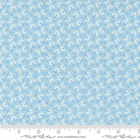 The image is a fabric with a repeating pattern of blue flowers and white flowers. The pattern is composed of small blue flowers and white flowers arranged in a grid-like fashion. The fabric appears to be light blue in color.