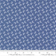 a fabric with a repeating pattern of blue flowers on a dark blue background. The pattern consists of small white flowers arranged in a grid-like fashion, creating a visually appealing and intricate design.