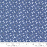 a fabric with a repeating pattern of blue flowers on a dark blue background. The pattern consists of small white flowers arranged in a grid-like fashion, creating a visually appealing and intricate design.