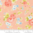 a fabric with a floral pattern of pink roses and blue flowers on a peach background.
