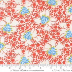 The image is a fabric with a floral pattern in shades of red, white, and blue. The pattern consists of various flowers and leaves, creating a visually appealing and vibrant design.