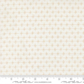 The image is a fabric with a repeating pattern of small white stars or dots arranged in a diagonal grid. The fabric appears to be a light-colored material, possibly white or cream-colored. The image does not contain any text or other discernible objects or actions.