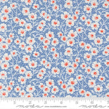 a repeating pattern of white and red flowers on a blue background.