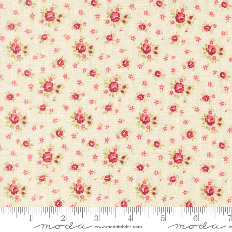 a fabric with a floral pattern of red and green flowers.