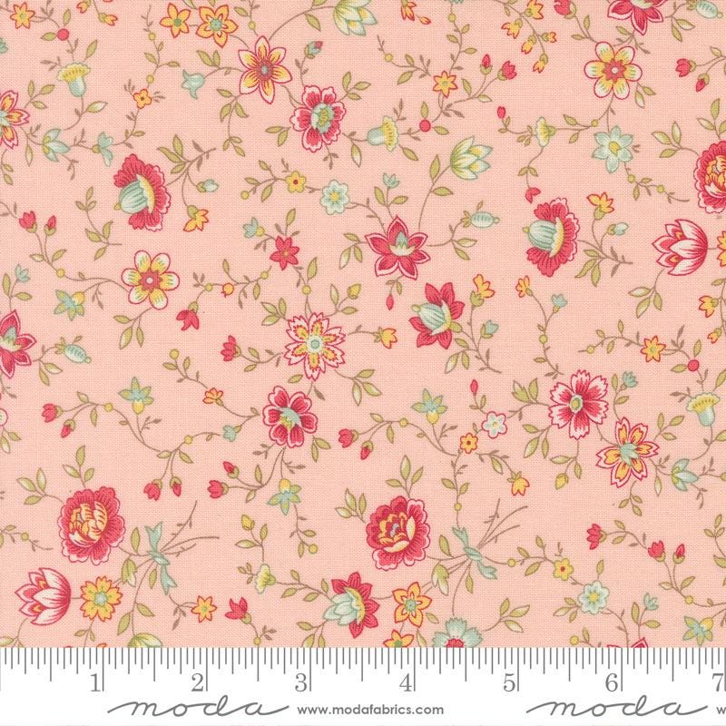 The image is a fabric with a floral pattern in shades of pink and green. The pattern consists of various flowers and leaves, creating a visually appealing and intricate design. The fabric appears to be a soft, pastel-colored material, suitable for sewing or other textile applications.