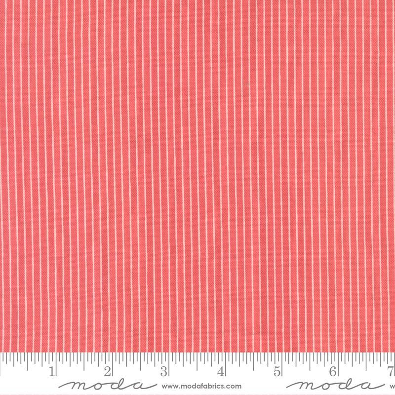 The image is a close-up of a fabric with vertical red stripes.