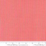 The image is a close-up of a fabric with vertical red stripes.