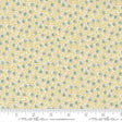 The image is a fabric with a floral pattern in shades of yellow and green.