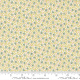 The image is a fabric with a floral pattern in shades of yellow and green.