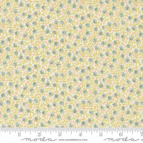 The image is a fabric with a floral pattern in shades of yellow and green.
