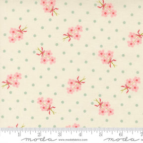 a fabric with a floral pattern and polka dot design.