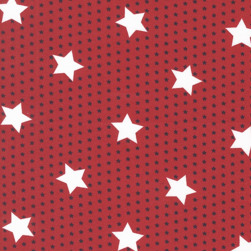a pattern of red and black dots, with white stars scattered throughout the background.