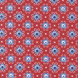 a repeating pattern of blue and white flowers on a red background.