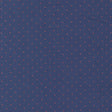 a close-up view of a fabric with a pattern of small red dots against a navy blue background.