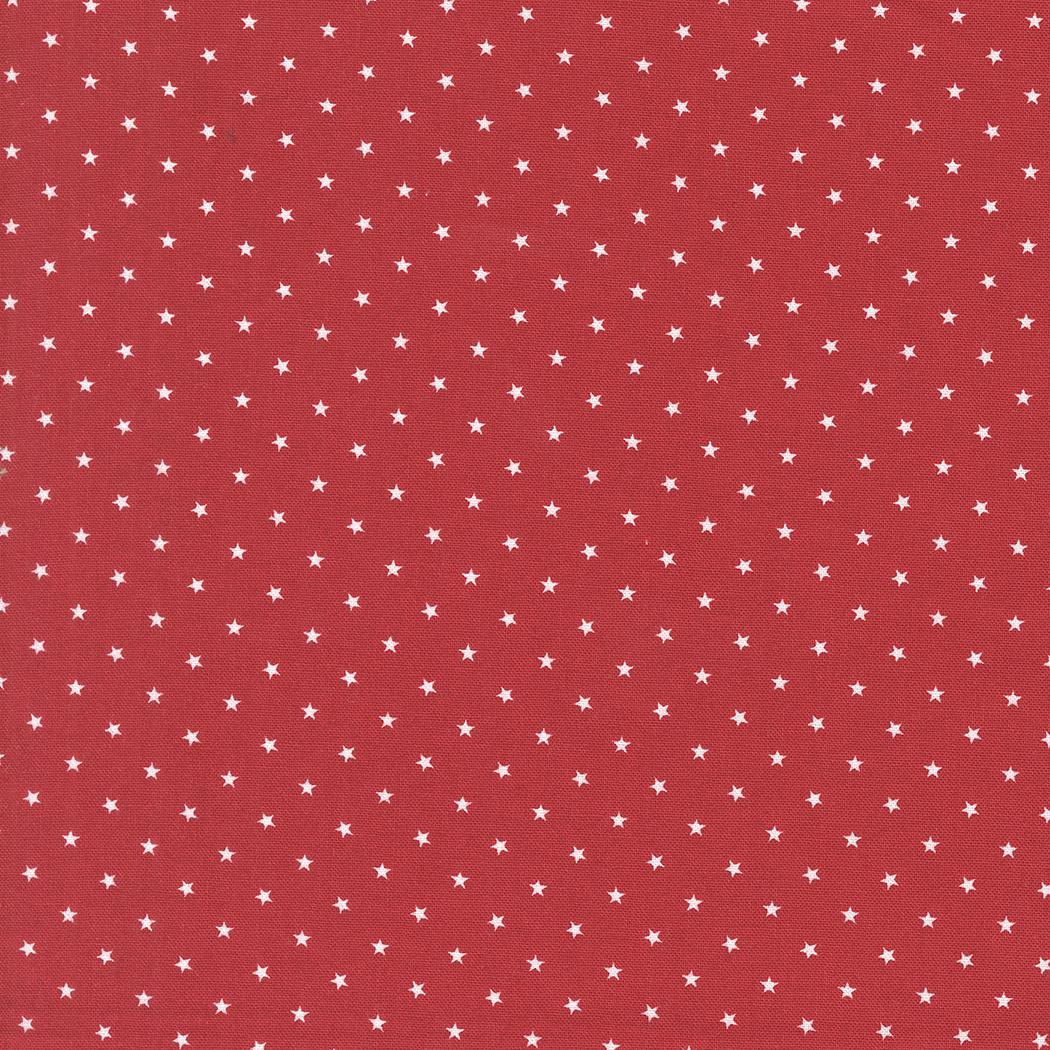 a red background with white stars scattered across it.