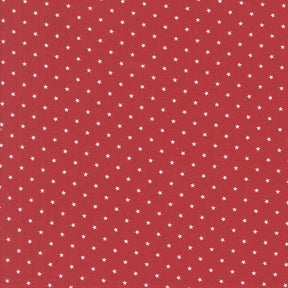 a red background with white stars scattered across it.