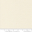 The image is a fabric with a repeating pattern of small white flowers or dots. The fabric appears to be light beige in color.