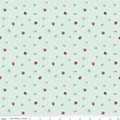 a repeating pattern of small green leaves and orange ladybugs on a light blue background.