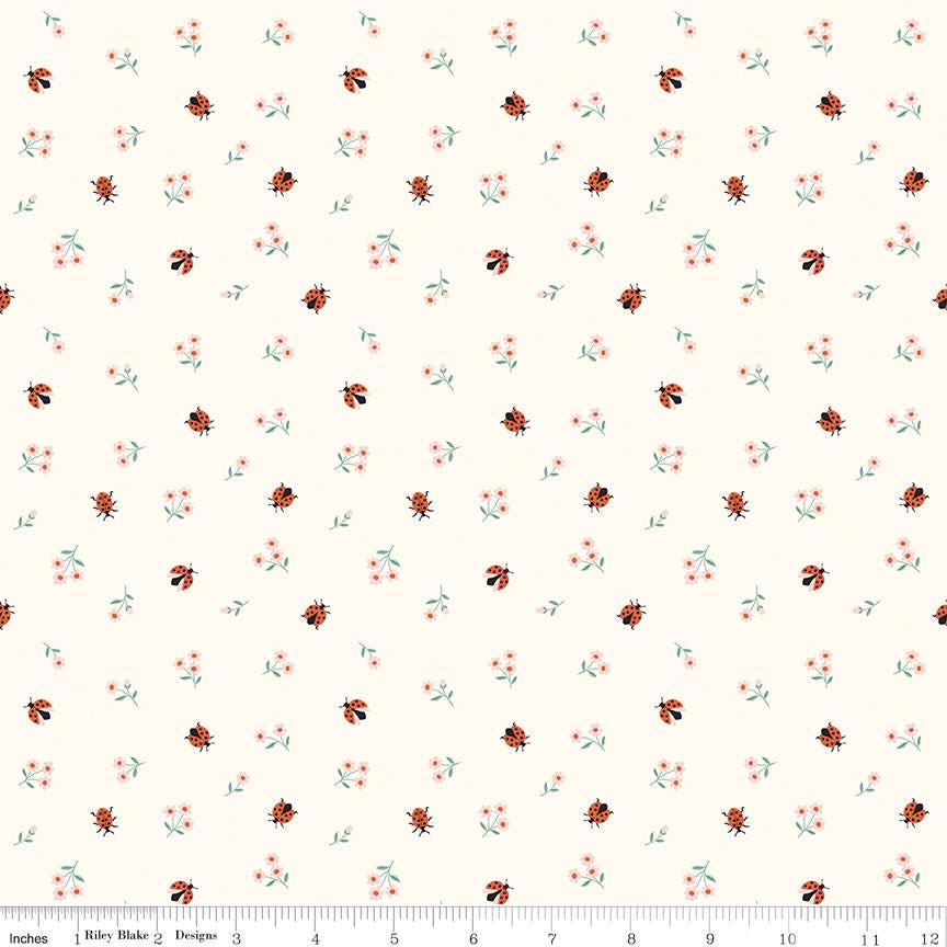 a repeating pattern of small ladybugs and flowers on a light background.