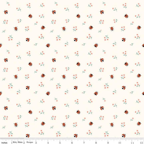 a repeating pattern of small ladybugs and flowers on a light background.