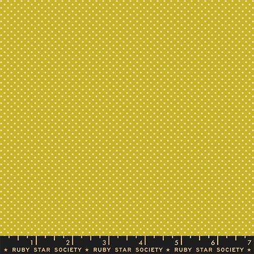 The image is a large yellow fabric with white polka dots.