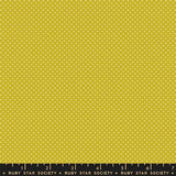 The image is a large yellow fabric with white polka dots.