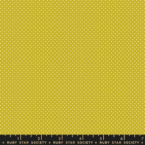 The image is a large yellow fabric with white polka dots.