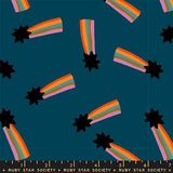 a pattern of colorful rainbows and stars against a dark blue background.