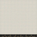 The image is a repeating pattern of small black dots on a cream-colored background.