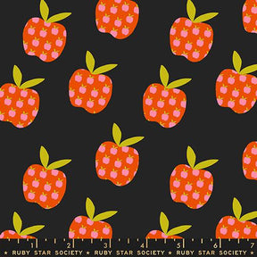 a pattern of stylized apples with green leaves against a dark background.