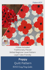 May include: A quilt pattern featuring a poppy design. The quilt has red poppy flowers with black centers on a white and blue patterned background. The pattern includes the text "Poppy Quilt Pattern" and "©2023 Easy Piecy Quilts".